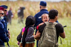 2C1355BF00000578-3226888-Tempers_fray_Migrants_are_angry_at_having_to_wait_for_hours_in_t-a-52_1441742673030