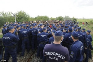 2C15149D00000578-3226888-DOzens_of_police_circled_around_the_migrants_they_managed_to_cat-a-7_1441747865789