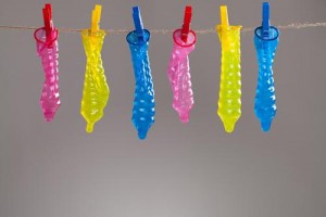 colorful-condoms-hanging-rope-clothespins