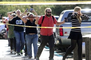 2CFDE4E100000578-3257142-Students_staff_and_faculty_with_their_hands_up_are_evacuated_fro-m-11_1443766336229