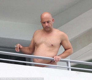 2D25D7D600000578-3262544-Enjoying_a_cheeky_smoke_Vin_Diesel_took_his_shirt_off_while_bask-m-85_1444167178728