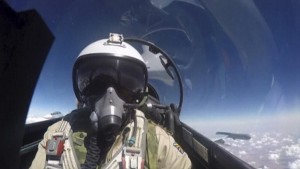 Frame grab shows a pilot of the Russian air force inside the cabin of a military jet during a sortie in Syria