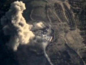 Frame grab taken from Russia's Defence Ministry footage shows explosion after airstrikes carried out by Russian air force in Idlib province, Syria