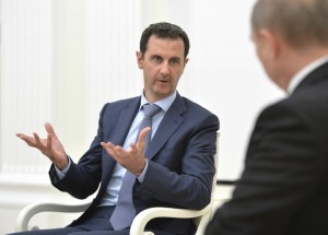 Syrian President Assad speaks during a meeting with Russian President Putin at the Kremlin in Moscow