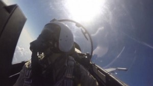 Frame grab shows a pilot of the Russian air force inside the cabin of a military jet during a sortie in Syria