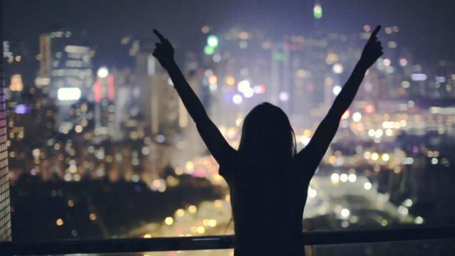 happy-girl-roof-night-footage-070875273_prevstill-1024x576